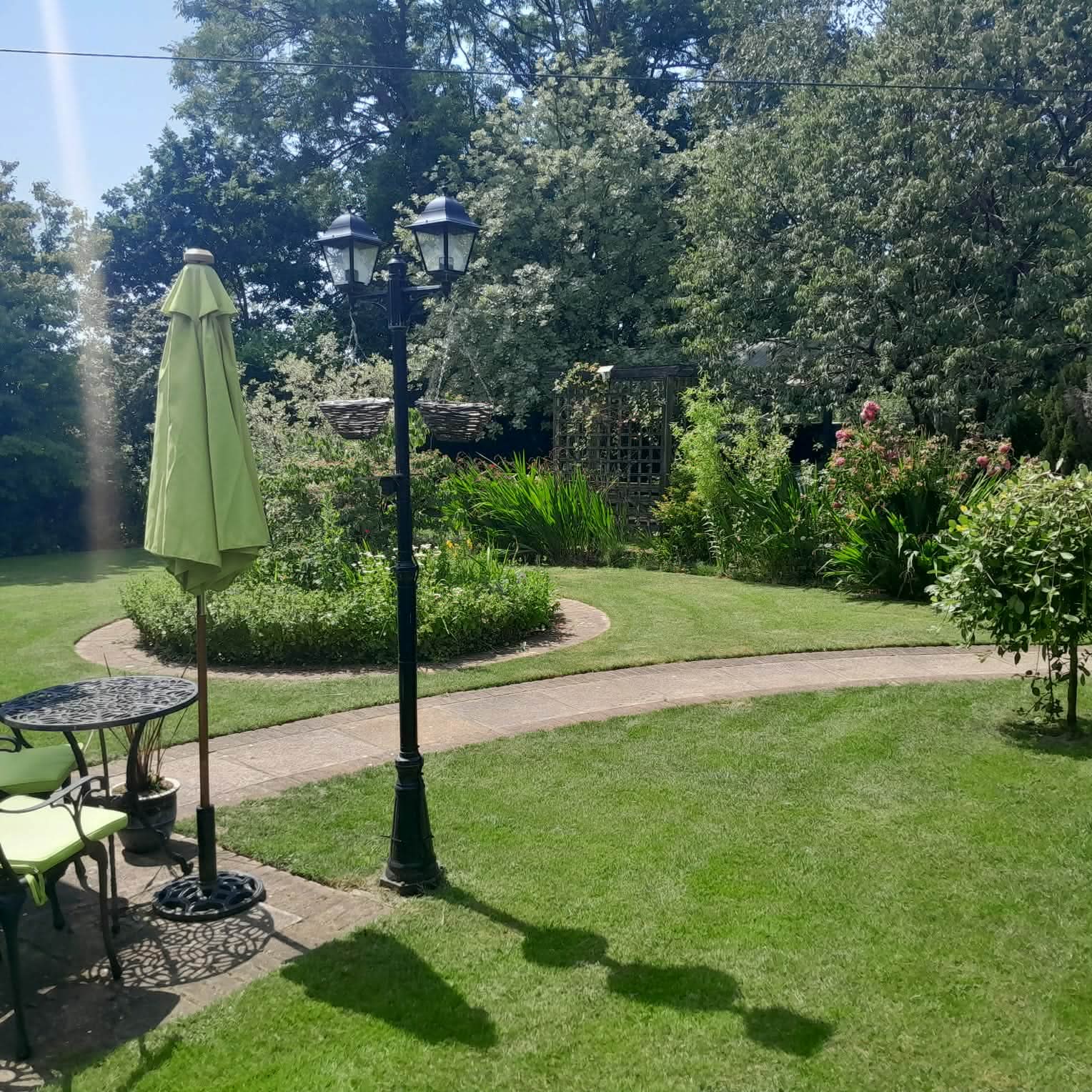 Landscaped garden with lawn, borders and paths